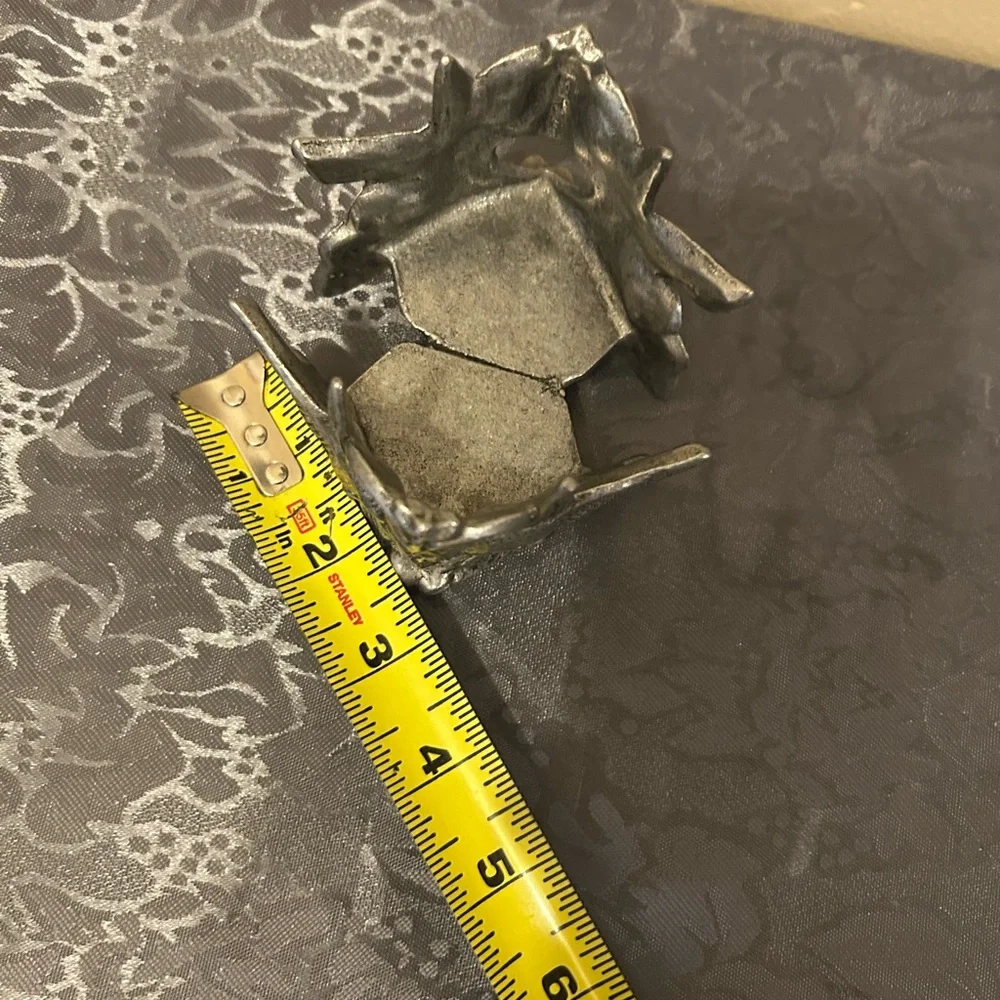 Pewter candle holder features hummingbirds and hearts